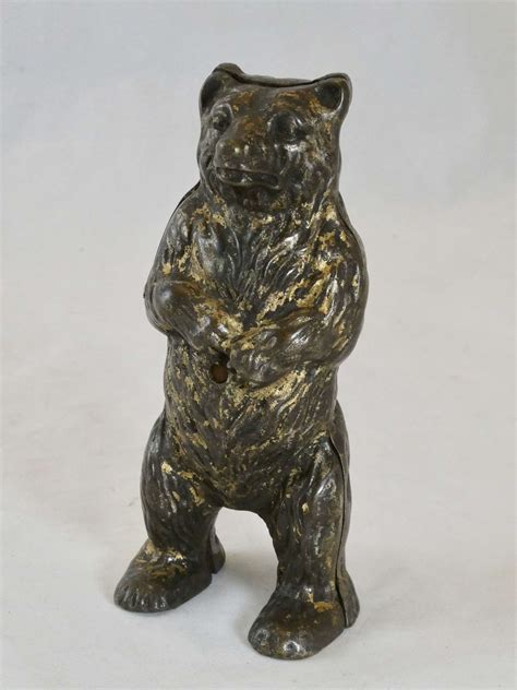 cast metal bear money box|money box with moving arm.